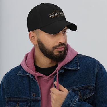 man wearing a Square body hat from aggressive thread in black